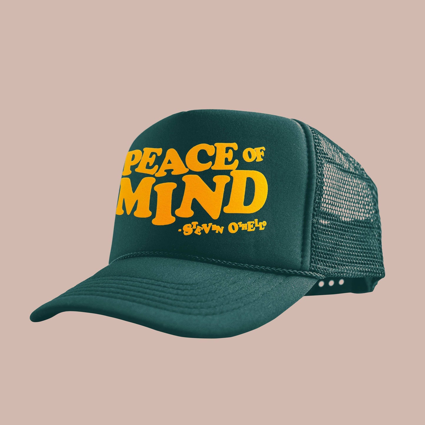 Peace Of Mind trucker hat featuring foam fabrication, mesh paneling, curved brim, and adjustable snap closure.