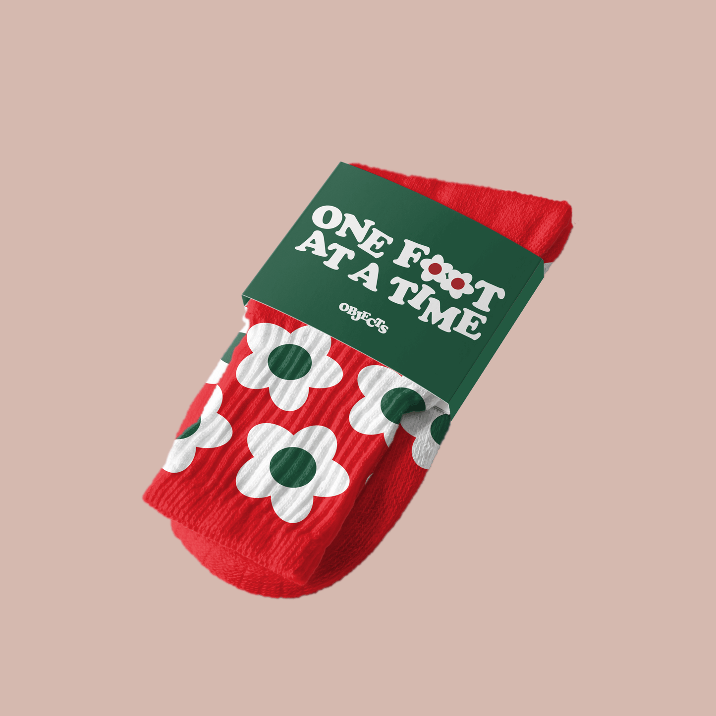 Red Bloom Socks two pack by Steven Othello featuring playful flower prints and a green band with 'One Foot At A Time'.