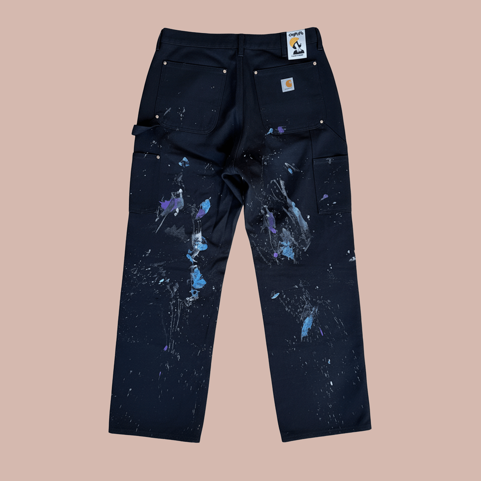Back view of hand painted work pants featuring colorful splashes by Steven Othello x Carhartt.