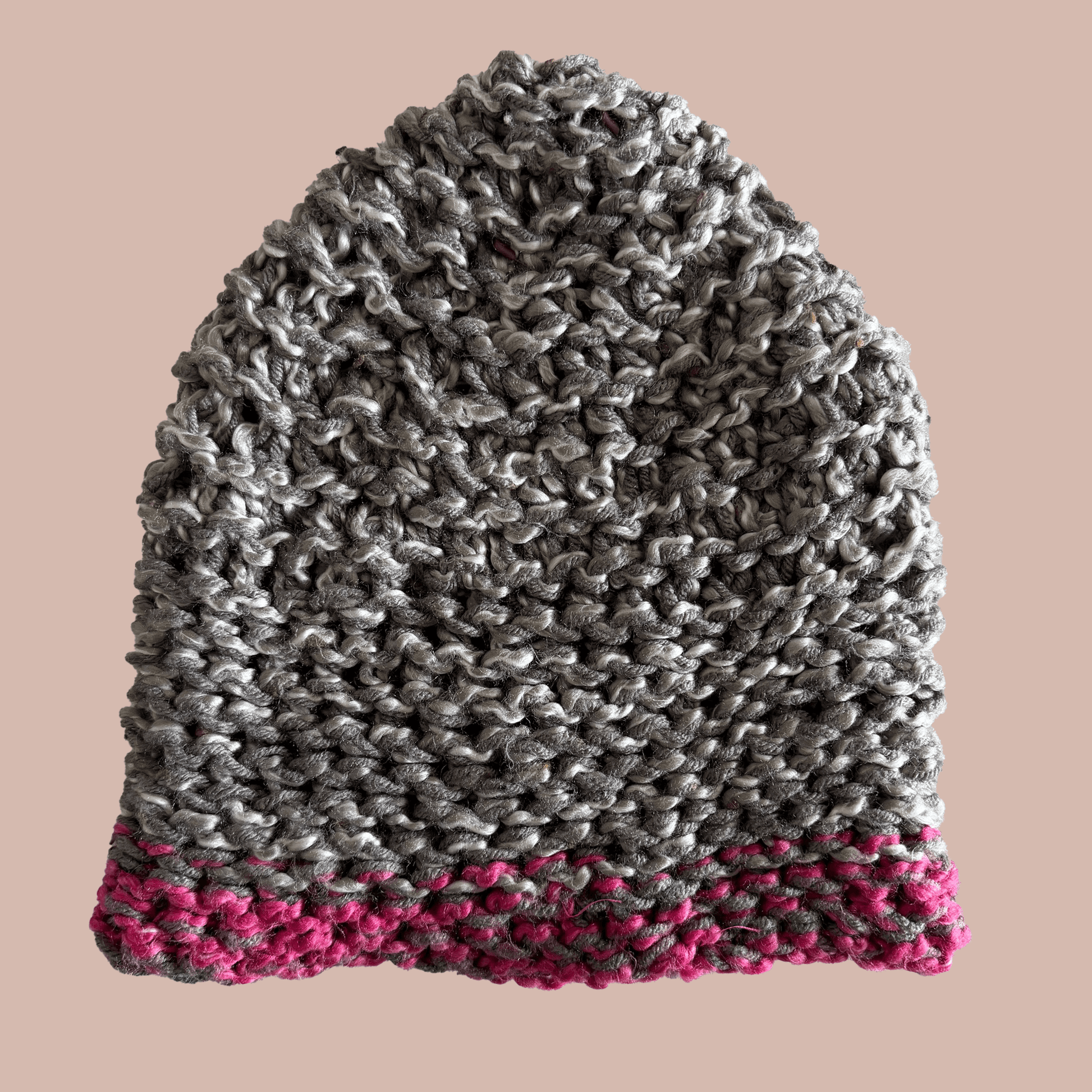 Hand knitted crochet hat in grey with pink trim, unique and completely handmade by artist Kristine Wong Chong.